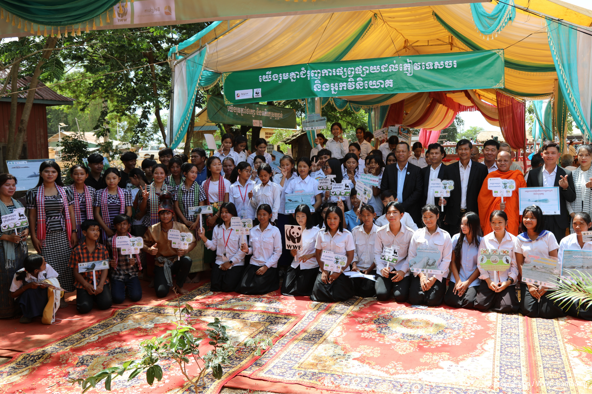 Community members celebrating the market's opening and its contribution to nature conservation.